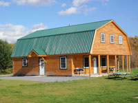 Log Cabin Rental Photos - Downstairs Bedroom - Maine Whitewater